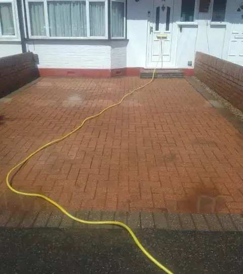 Power Washing Driveway after image After image of a paved driveway in Salthill having been power washed clean