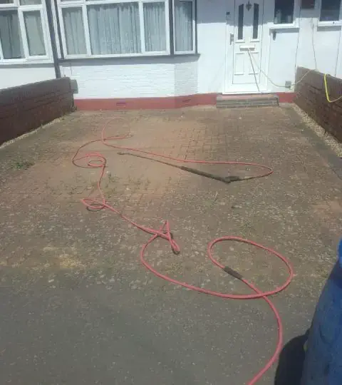 Power Washing Driveway before image Before image of a paved driveway in Salthill about to be power washed clean